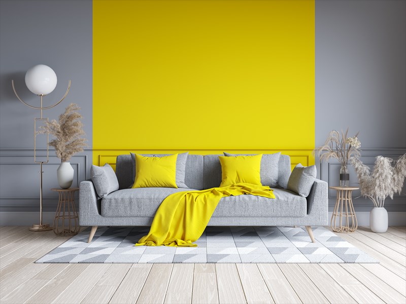 Wohnzimmer graue Wand mit Gelb